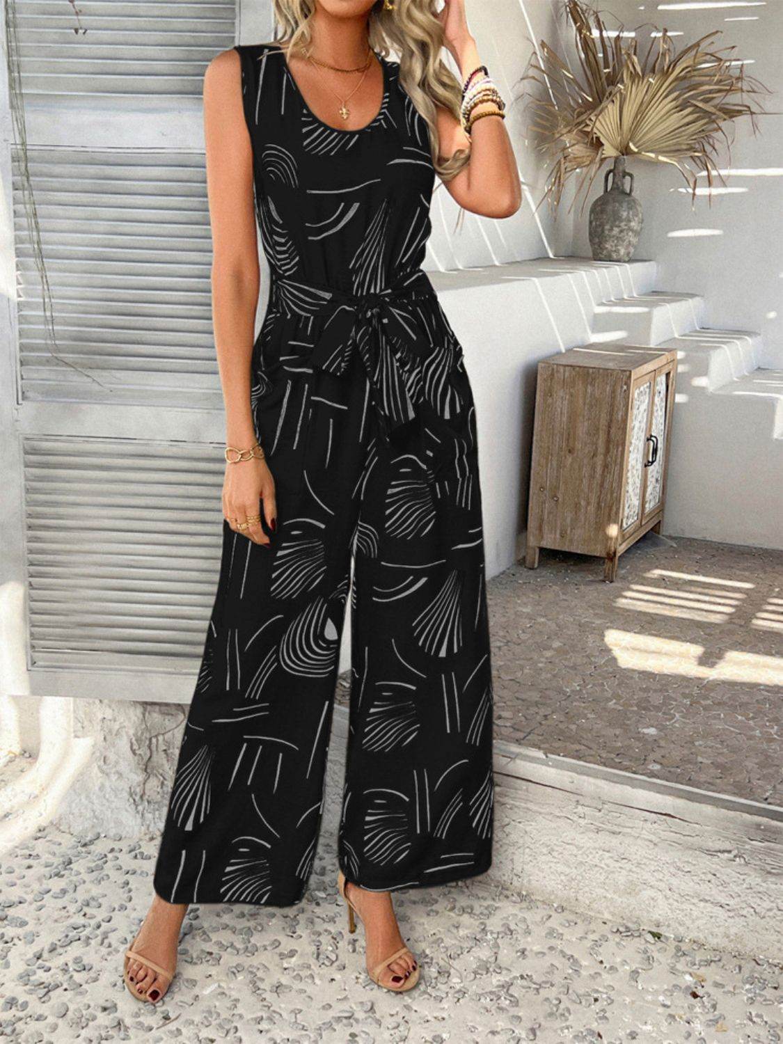 Devine Printed Round Neck Sleeveless Tie Waist Jumpsuit - Hovatok