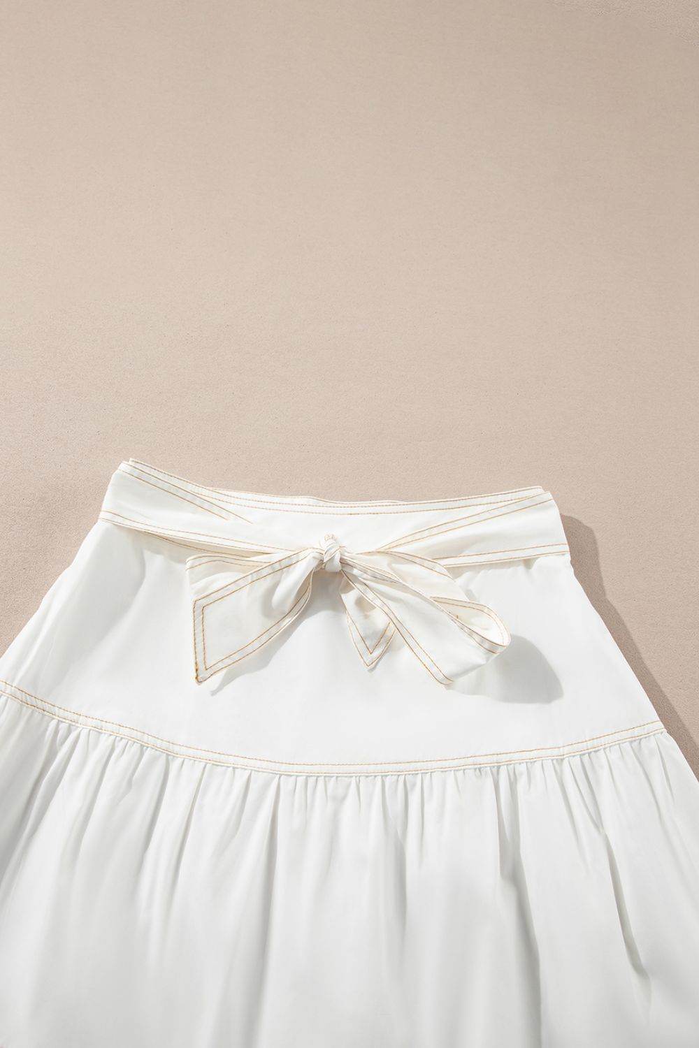 Contrast Stitching Trim Knotted High Waist A-Line Mini Skirt - Hovatok