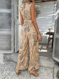 Devine Printed Round Neck Sleeveless Tie Waist Jumpsuit - Hovatok