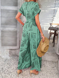Devine Printed Notched Short Sleeve Wide Leg Jumpsuit - Hovatok