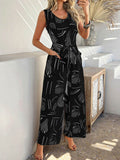 Devine Printed Round Neck Sleeveless Tie Waist Jumpsuit - Hovatok