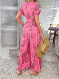 Devine Printed Notched Short Sleeve Wide Leg Jumpsuit - Hovatok