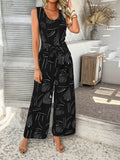 Devine Printed Round Neck Sleeveless Tie Waist Jumpsuit - Hovatok